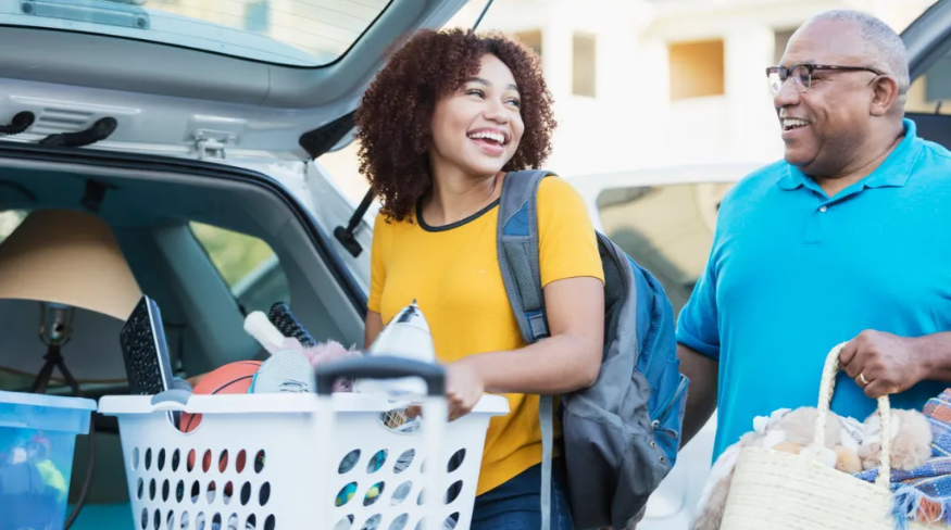Dad helping his daughter relocate, into an apartment or college dorm.