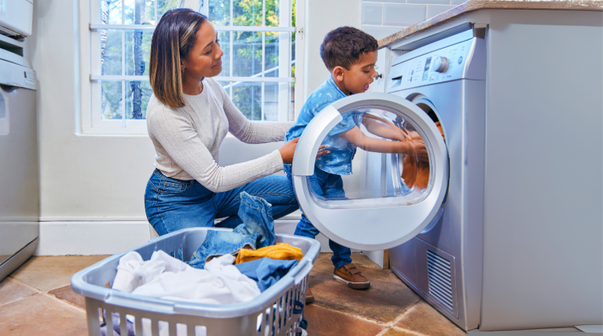 Mother and son doing laundry together.
